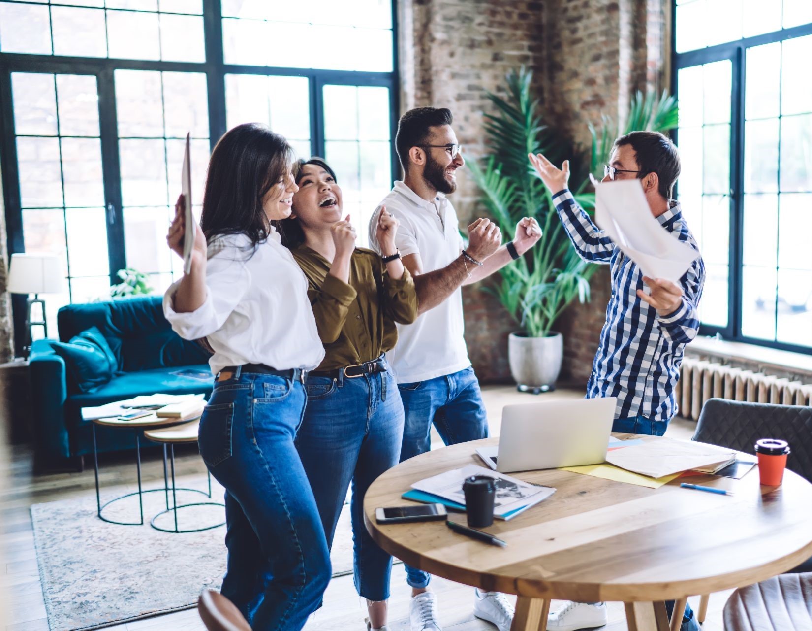 https://reinhartgroup.co.uk/wp-content/uploads/2023/12/happy-multiracial-coworkers-cheering-each-other-ar-2023-11-27-05-37-07-utc-1-1.jpg